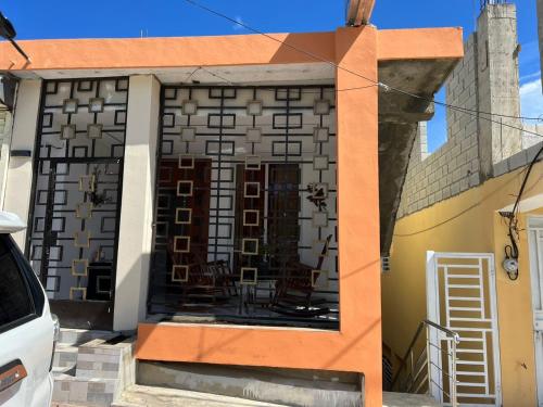 a building with a room with chairs in it at Apartamento la familia 2 in Santa Bárbara de Samaná