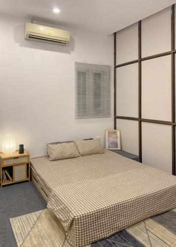 Postel nebo postele na pokoji v ubytování Luami Homestay