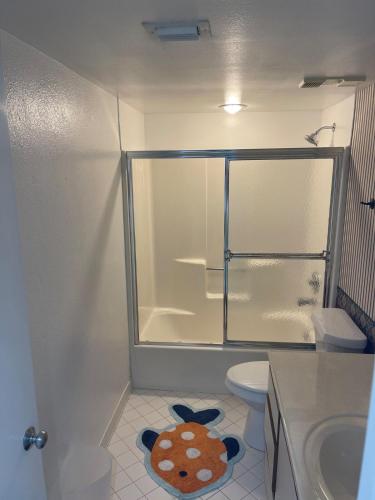 a bathroom with a toilet and a sink at 1 Bedroom Condo with Amazing View in Pensacola Beach