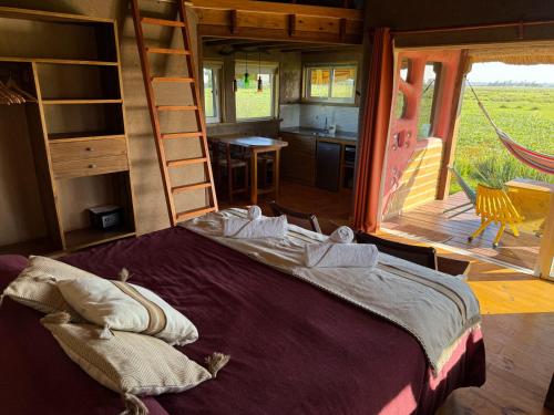 Postel nebo postele na pokoji v ubytování Los Chajá Ecolodge