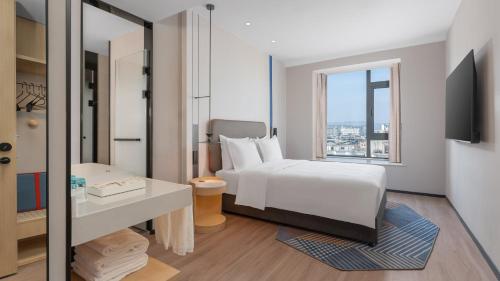Ένα ή περισσότερα κρεβάτια σε δωμάτιο στο Holiday Inn Express Longyan Liancheng by IHG