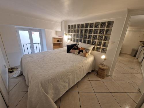 a bedroom with a large bed in a room at Le Cosy - Place Masséna in Nice