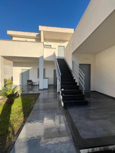 a house with a staircase leading to the front yard at Dodi's house in Pozzuoli