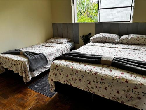 Postel nebo postele na pokoji v ubytování Casa Praça JK - Diamantina