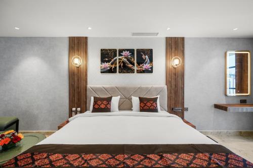 Hotel Grand Kasturiにあるベッド