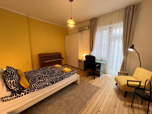 a bedroom with a zebra print bed and a desk at Florence family 2BDR Apt - min from Serdika w WiFi in Sofia