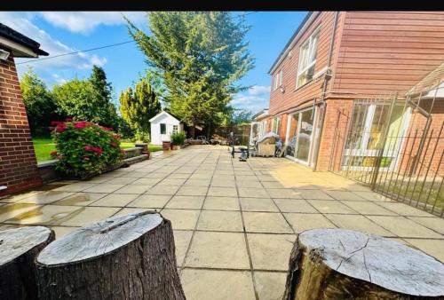 a street with a tree stump and a building at A cozy apartment in Windsor