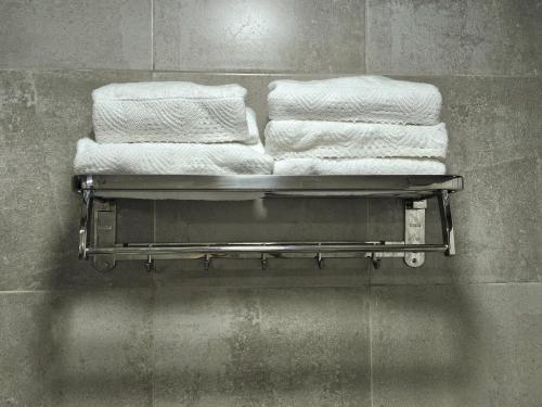 a group of towels on a towel rack in a bathroom at Elysium de Uco in Tupungato