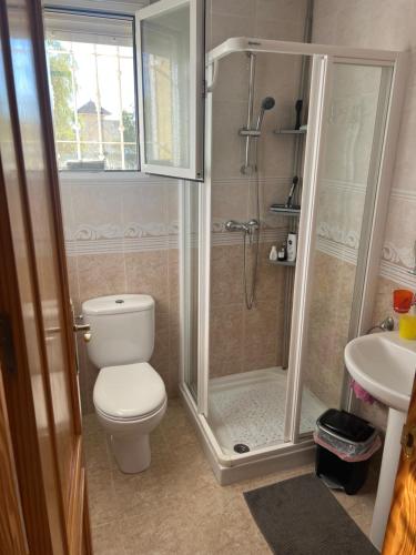 a bathroom with a shower and a toilet and a sink at Casa El Mirador in Viña de Raja