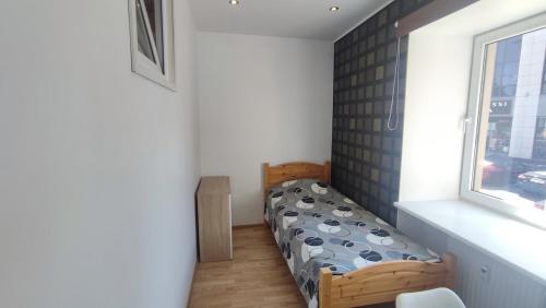 a bedroom with two beds and a window at Bright 2-BDRM central apartment in Tallinn