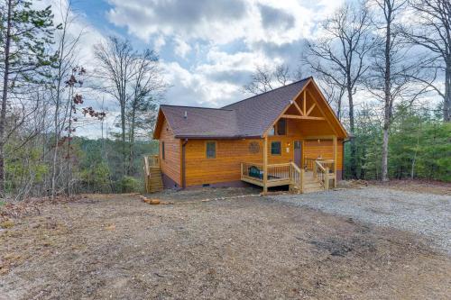 a large wooden cabin in the middle of the woods at Fall Colors, Deck and Fireplace Murphy Mtn Retreat! in Murphy