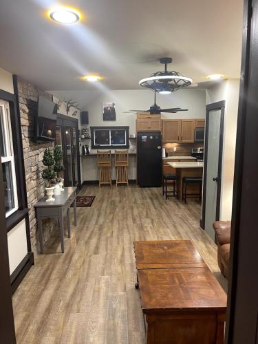 a living room with a kitchen and a dining room at Twin Oaks Cabin at Linville, Private, New remodel in Newland