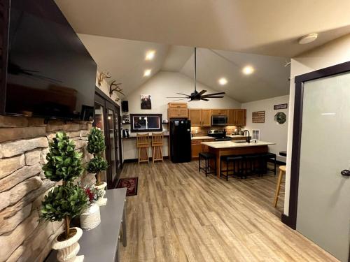 a living room with a kitchen and a dining room at Twin Oaks Cabin at Linville, Private, New remodel in Newland