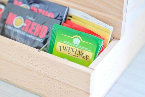 a drawer with books in a wooden box at Chiaia Di Rose Rooms & Apartment in Ischia