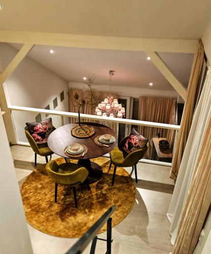 a dining room with a table and chairs at Taunusgarten in Bad Camberg