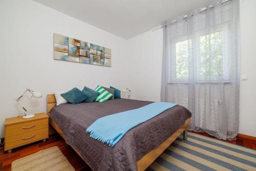 Postel nebo postele na pokoji v ubytování Apartment Helena