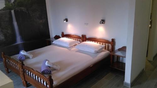 Katil atau katil-katil dalam bilik di Apartments and Room Rest