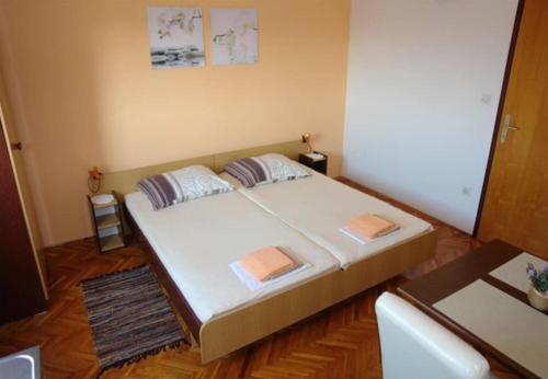 Posteľ alebo postele v izbe v ubytovaní Apartments Ognjen
