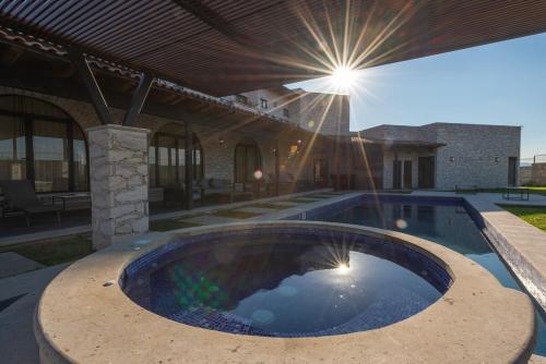 a swimming pool in the middle of a house at Quinta Don Luis in Querétaro