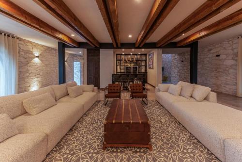 a living room with two couches and a coffee table at Quinta Don Luis in Querétaro
