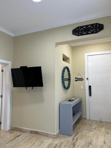 a room with a flat screen tv on a wall at Best ocean view Sosua-Cabarete in Sosúa