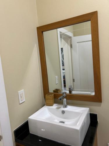 a bathroom with a white sink and a mirror at Best ocean view Sosua-Cabarete in Sosúa