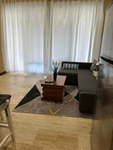 a living room with a couch and a coffee table at Best ocean view Sosua-Cabarete in Sosúa