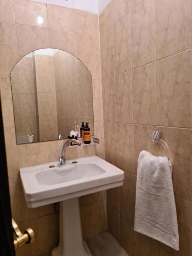a bathroom with a sink and a mirror at Hotel Appart HB in Marrakesh