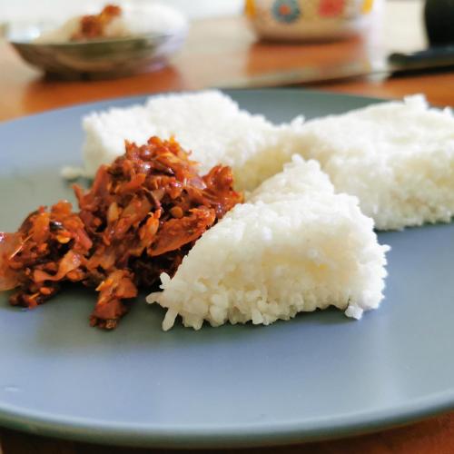 two pieces of rice on a blue plate at Nivartana Villa and Purana Ayurveda Center in Bentota