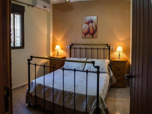 A bed or beds in a room at Casa Rural El Cuco