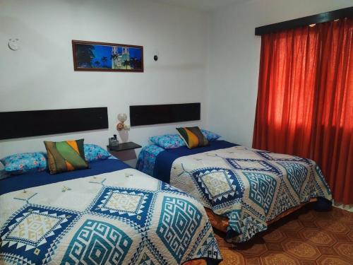 Un pat sau paturi într-o cameră la Casa Pía Deluxe