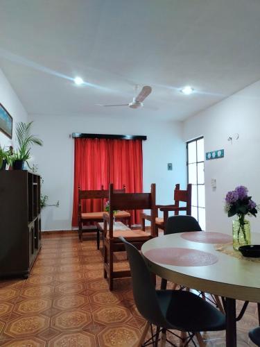 a living room with a table and chairs at Casa Pía Deluxe in Valladolid
