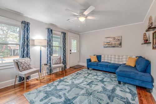 a living room with a blue couch and a blue rug at Anchors Away in Park Circle with King Suite in Charleston
