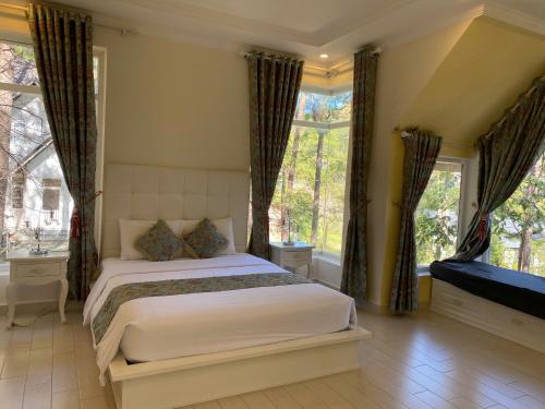 Ένα ή περισσότερα κρεβάτια σε δωμάτιο στο Lan Anh Villas Resort