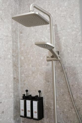 a shower with a shower head in a bathroom at Yatule Resort & Spa in Natadola