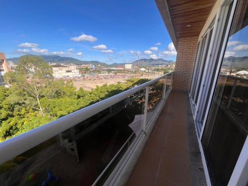 a balcony of a building with a view of a city at Amplio PH en Margarita Real in Pampatar