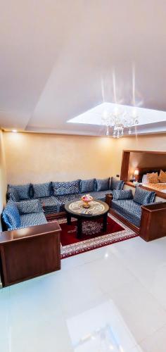a living room with a couch and a table at Palm's Hotel Club in Erfoud