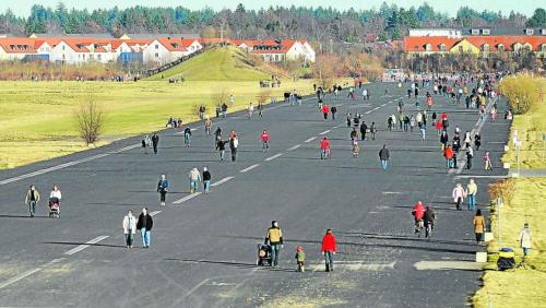 a large group of people walking down a road at Attractive 2 room apartment south of Munich in Ottobrunn
