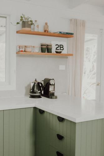 a kitchen counter with a tea kettle on it at Birch Cottage Trentham in Trentham