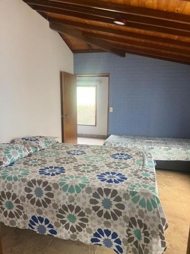 Postel nebo postele na pokoji v ubytování Casa Coral NECOCLI