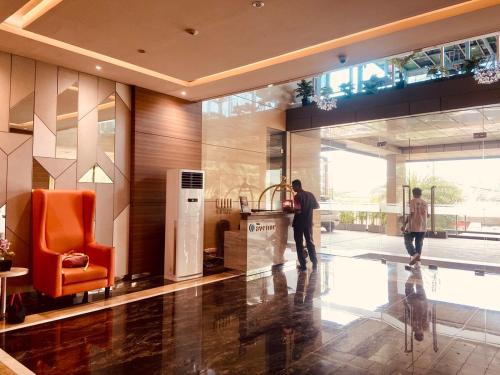 Μια τηλεόραση ή/και κέντρο ψυχαγωγίας στο 2 Bedroom Cozy Apartment in BSD
