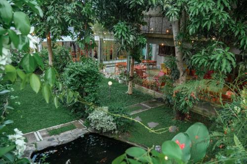 an aerial view of a garden with a pond at Djajanti House in Semarang