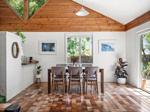 a dining room with a table and chairs at Ryma Cottage - Prevelly NEW in Prevelly