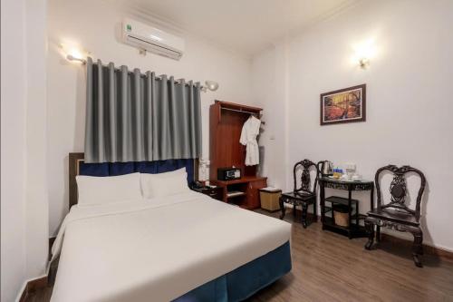 Postel nebo postele na pokoji v ubytování A25 Hotel - Đội Cấn 1