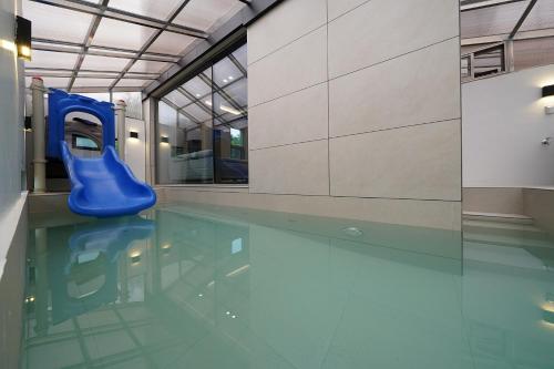 a swimming pool with a blue rubberucky in the water at Gyeongju Poolvilla Runtoyou in Gyeongju