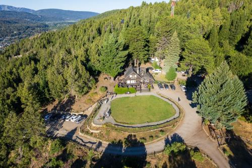 an aerial view of a house in the middle of a forest at Arrayan Lake View Mountain Lodge & Casa De Te Arrayan in San Martín de los Andes