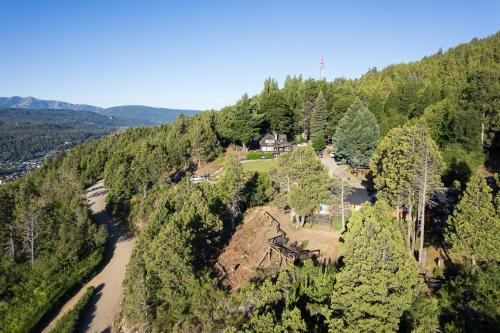 an aerial view of a house on top of a mountain at Arrayan Lake View Mountain Lodge & Casa De Te Arrayan in San Martín de los Andes