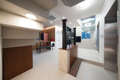 a living room with a fireplace in the middle of a room at Gyeongju Poolvilla Runtoyou in Gyeongju