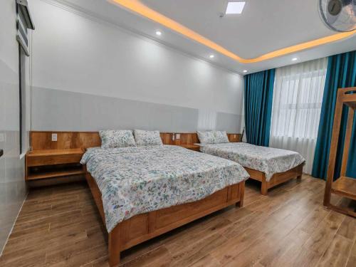 a bedroom with two beds in a room at Căn Hộ 4 PN Rin's House Homestay in Phan Thiet