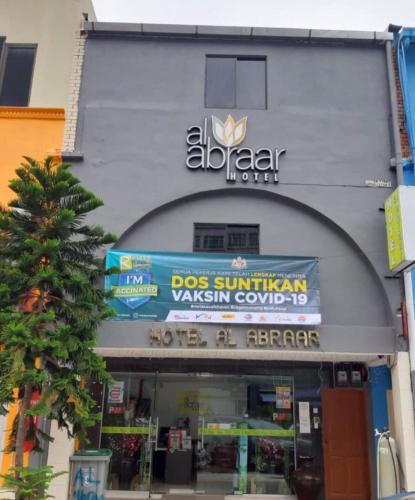 an algarzar store with a sign on the front of it at Hotel Al Abraar in Melaka